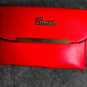 Clutch/wristlet.  Red with Gucci logo.